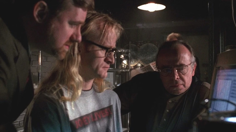 John Fitzgerald Byers (Bruce Harwood), Ringo Langly (Dean Haglund), and Melvin Frohike, (Tom Braidwood) look at a computer screen in The Lone Gunmen