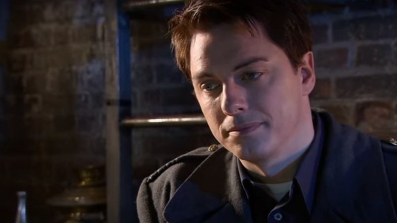 Jack Harkness (John Barrowman) looks downcast in Torchwood