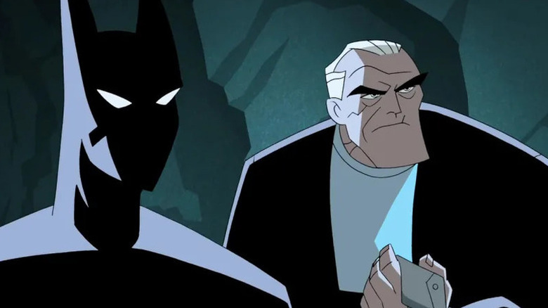 Terry McGinnis (Will Friedle) and Bruce Wayne (Kevin Conroy) stand next to each other in the Batcave in Batman Beyond