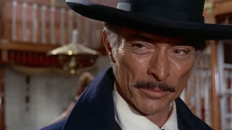 Sabata (Lee Van Cleef) smirks slightly in Sabata