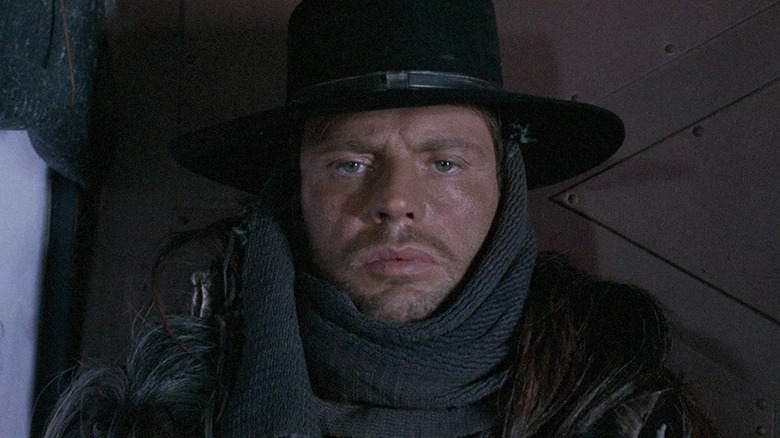 Loco (Klaus Kinski) stares intently in The Great Silence