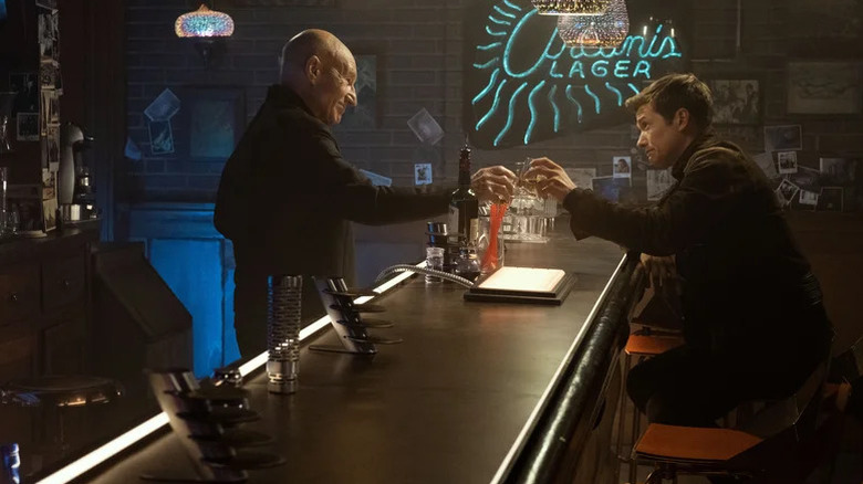 Jean-Luc Picard (Patrick Stewart) toasts Jack Crusher (Ed Speleers) over a bar in Star Trek: Picard