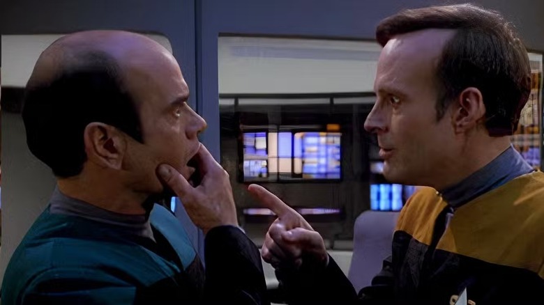 The Doctor (Robert Picardo) reacts in shock as Reginald Barclay (Dwight Schultz) points at him in Star Trek: Voyager