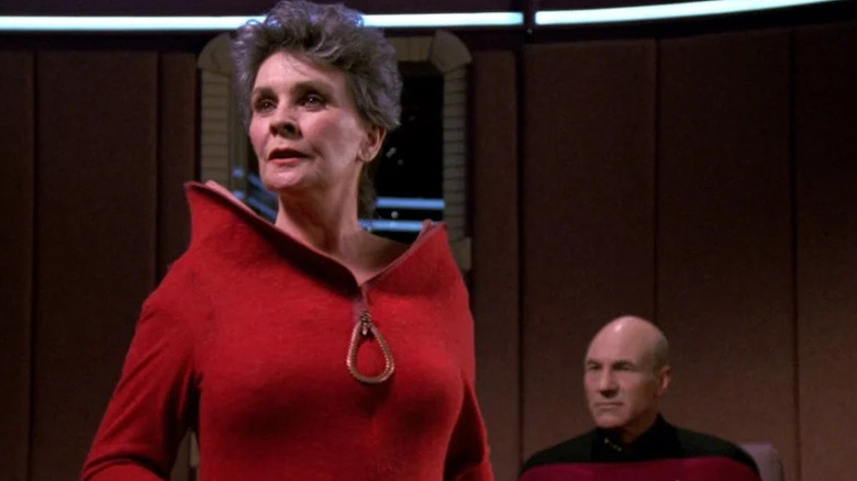 Norah Satie (Jean Simmons) leads a trial as Jean-Luc Picard (Patrick Stewart) eyes her warily in Star Trek: The Next Generation