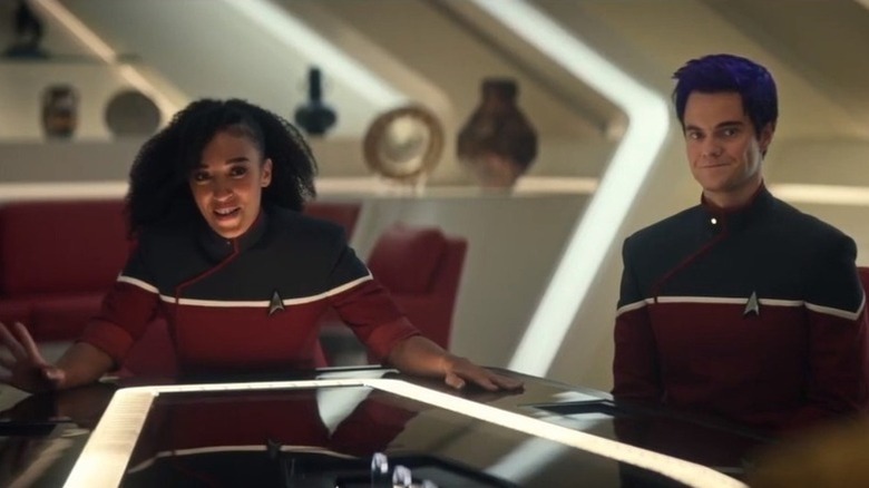 Beckett Mariner (Tawny Newsome) and Brad Boimler (Jack Quaid) sit at the end of a table in Star Trek: Strange New Worlds