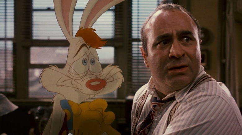 Roger Rabbit (Charles Fleischer) begs Eddie Valiant (Bob Hoskins) in Who Framed Roger Rabbit?