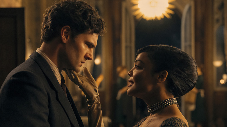 Hedda touches George's chin in Hedda