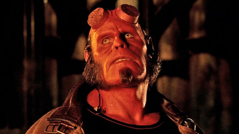 Hellboy (Ron Perlman) glances up