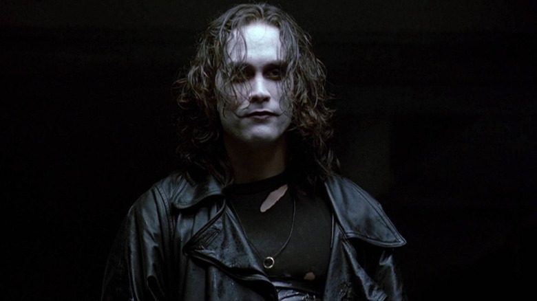 Eric Draven (Brandon Lee) stands in the shadows in The Crow (1994)