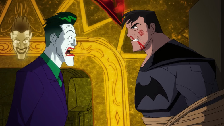 The Joker looks in shock at Bruce Wayne, unmasked, in Harley Quinn