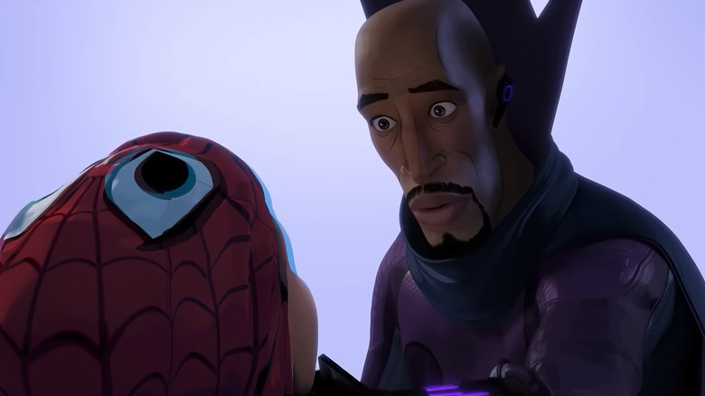 Aaron Davis looks down at Miles Morales, both of them unmasked, in Spider-Man: Into the Spider-Verse