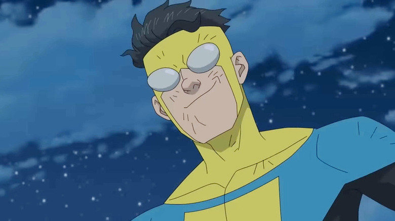 Mark Grayson (Steven Yeun) smiles while looking down from the night sky in Invincible