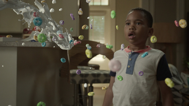 Dion Warren (Ja'Siah Young) watches cereal and milk fly in slow-motion in Raising Dion