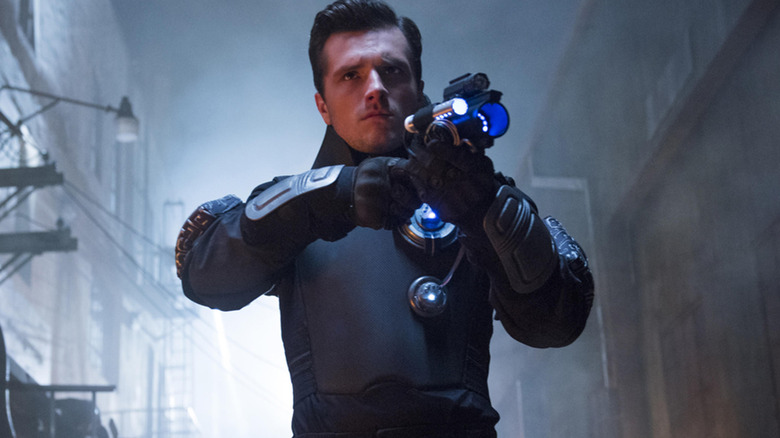 Josh Hutcherson as Josh Futturman, holding a weapon in Future Man