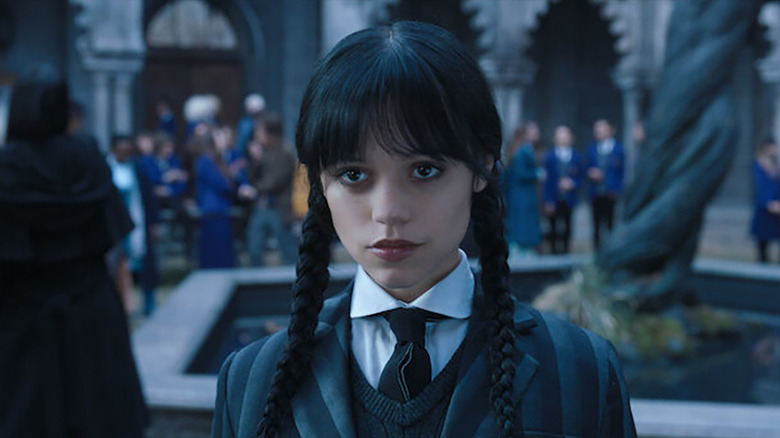 Jenna Ortega as Wednesday Addams in the school courtyard in Wednesday