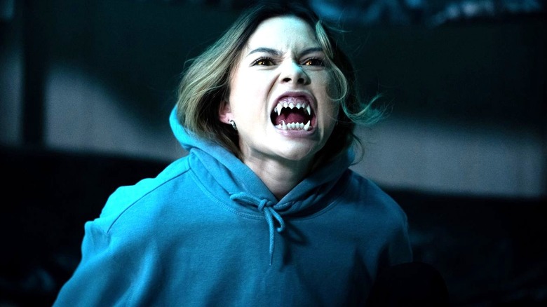 Bella Shepard as Blake Navarro looks ahead and shows werewolf fangs on Wolf Pack