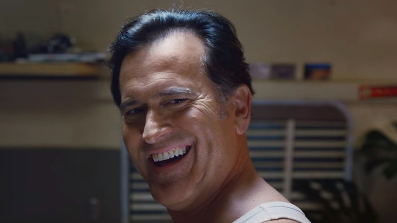 Ash Williams (Bruce Campbell) smiles widely in Ash vs Evil Dead