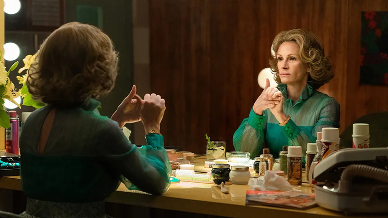 Martha Mitchell (Julia Roberts) stares at herself in a mirror in Gaslit