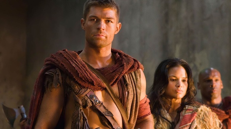 Spartacus (Liam McIntyre) stands next to Mira (Katrina Law) in Spartacus