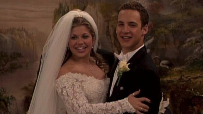 Topanga Lawrence (Danielle Fishel) and Cory Matthews (Ben Savage) hold each other during their wedding in Boy Meets World