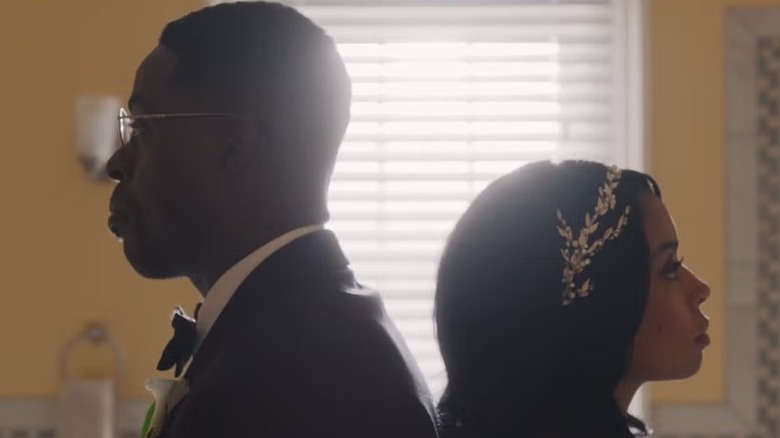 Randall Pearson (Sterling K. Brown) and Beth (Susan Kelechi Watson) stand back-to-back in This Is Us
