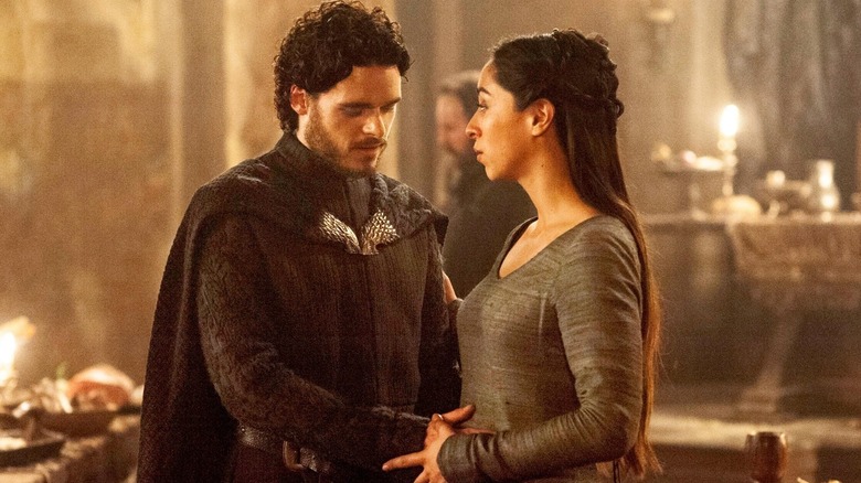 Robb Stark (Richard Madden) touches the pregnant stomach of Talisa Stark (Oona Chaplin) in Game of Thrones