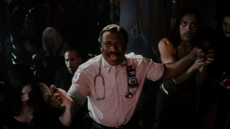 Ving Rhames as Marcus leading a prayer in Bringing Out the Dead