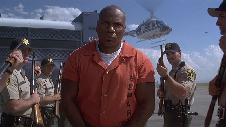 Ving Rhames as Nathan 'Diamond Dog' Jones surrounded by guards in Con Air