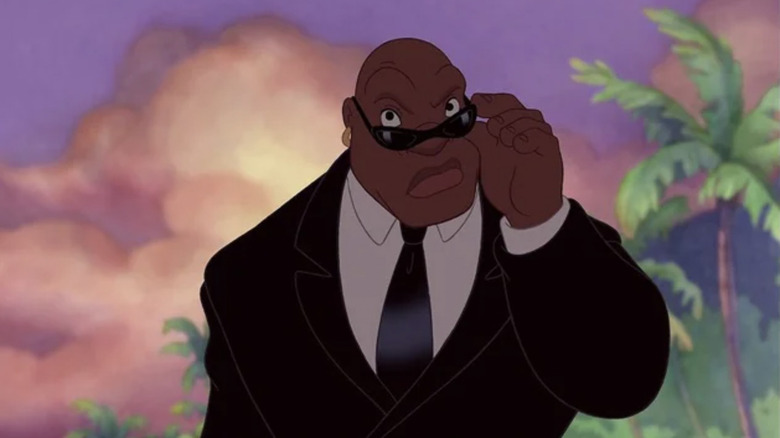 Bubbles, voiced by Ving Rhames, lowering his shades in Lilo & Stitch