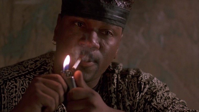 Ving Rhames as Leroy lighting up a cigarette in The People Under the Stairs