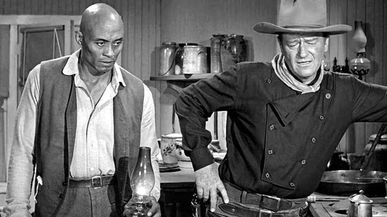 Woody Strode as Pompey and John Wayne as Tom, making plans in The Man Who Shot Liberty Valance