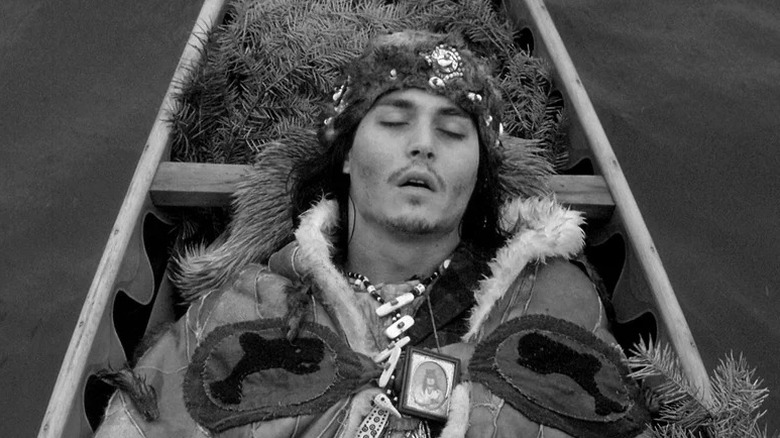 A dying William Blake (Johnny Depp) lays in a canoe in Dead Man