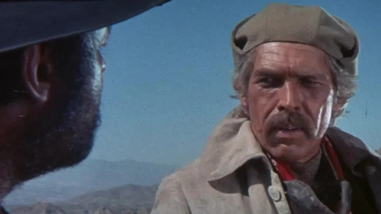 John Mallory (James Coburn) glances tersely at Juan Miranda (Rod Steiger) in Duck, You Sucker!