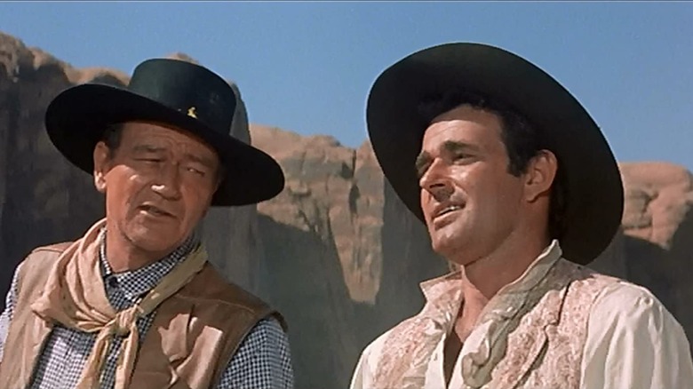 Jake Cutter (John Wayne) speaks to Paul Regret (Stuart Whitman) in The Comancheros