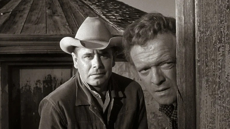 Ben Wade (Glenn Ford) and Dan Evans (Van Heflin) take cover in 3:10 to Yuma (1957)