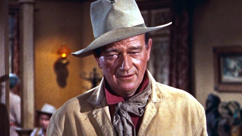 John T. Chance (John Wayne) sternly enters a saloon in Rio Bravo