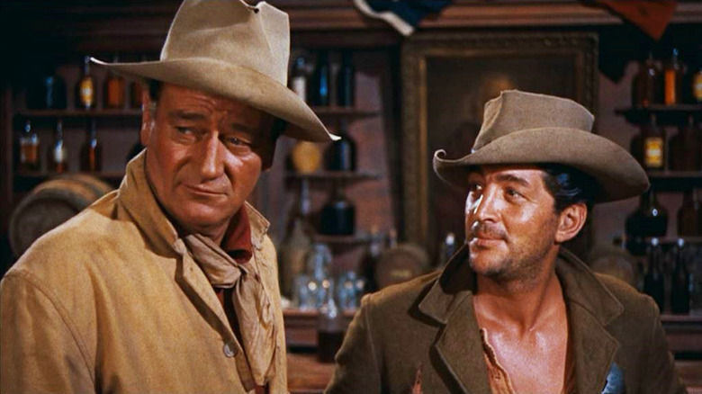 Dude (Dean Martin) glances at John T. Chance (John Wayne) in Rio Bravo