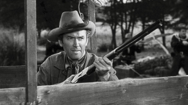 Lin McAdam (James Stewart) holds a rifle sternly in Winchester '73