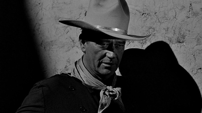 Tom Doniphon (John Wayne) stands in the shadows in The Man Who Shot Liberty Valance