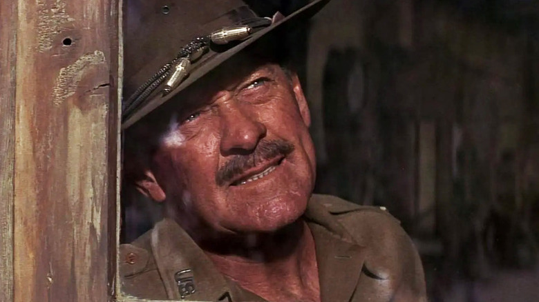Pike Bishop stares up through a window in The Wild Bunch