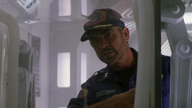 Sean Connery as O'Niel, looking for clues in Outland