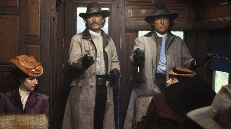 Stacy Keach as Frank and James Keach as Jesse, robbing a train in The Long Riders