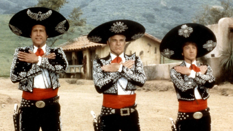 Chevy Chase as Dusty, Steve Martin as Lucky, and Martin Short as Ned, doing a routine in Three Amigos!