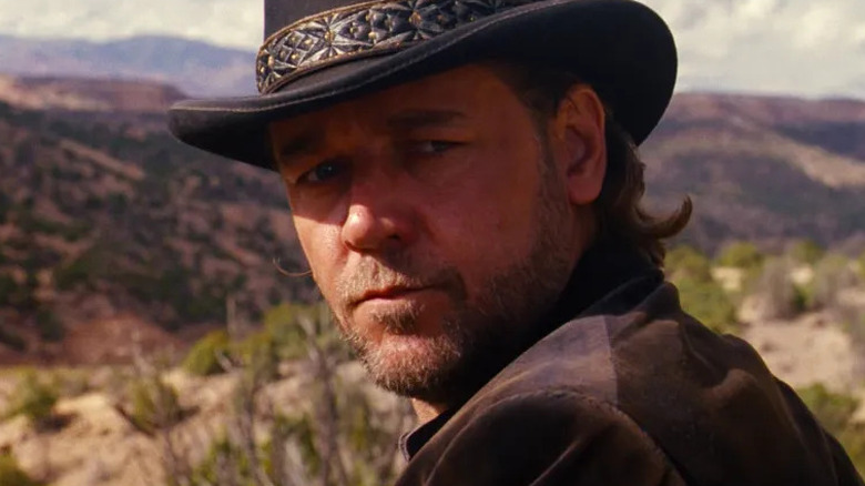 A medium shot of Russell Crowe as Ben Wade in 3:10 to Yuma, against a Western backdrop.