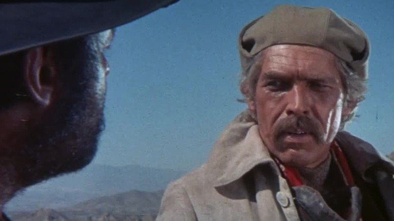 Juan Miranda (Rod Steiger) looks warily at John H. Mallory (James Coburn) in Duck, You Sucker!