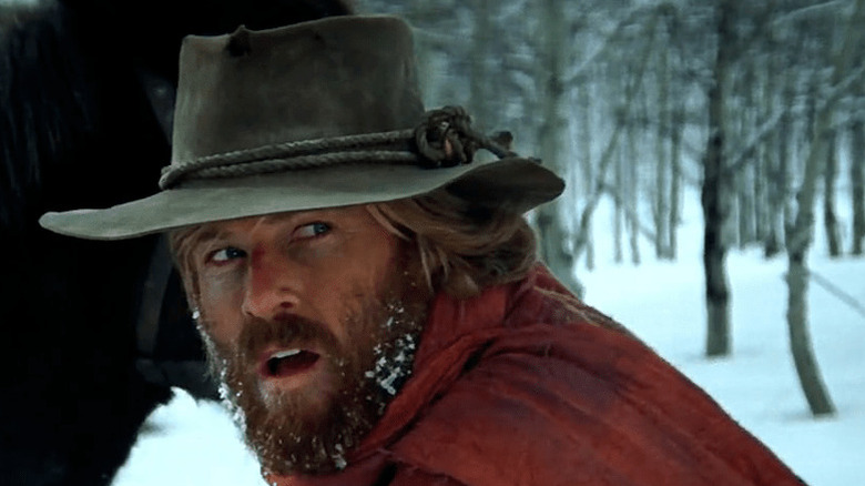 Jeremiah Johnson (Robert Redford) looks away from his horse with snow in his beard in Jeremiah Johnson
