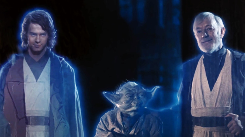 Hayden Christensen as Anakin Skywalker stands next to Frank Oz as Yoda and Alec Guinness as Obi-Wan Kenobi in Return of the Jedi