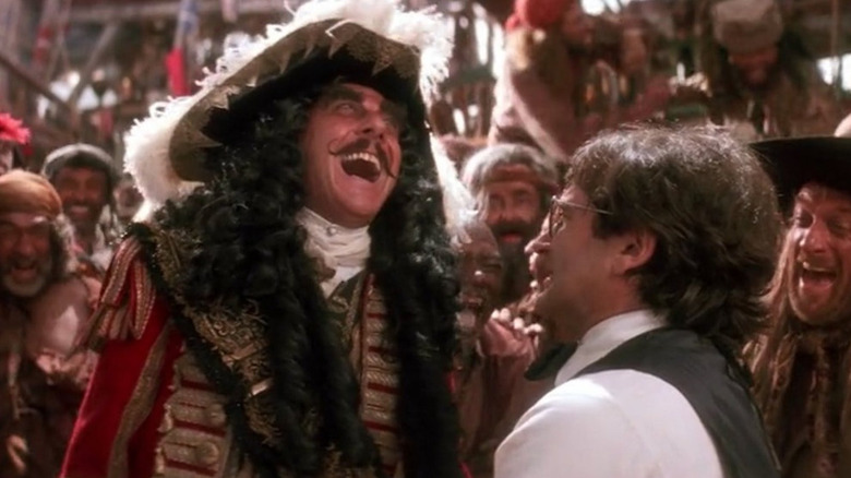 Captain Hook (Dustin Hoffman) laughs at Peter Banning (Robin Williams) on a pirate ship in Hook