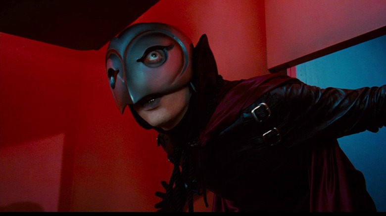 William Finley as Winslow Leach / the Phantom in Phantom of the Paradse, donning his mask and Phantom garb against a red background.