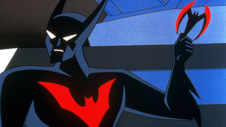 Terry McGinnis as Batman holding a batarang in the Batman Beyond animated series